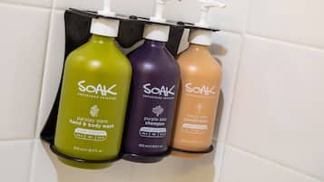 Three bottles of Soak superfood skincare products on a shelf.