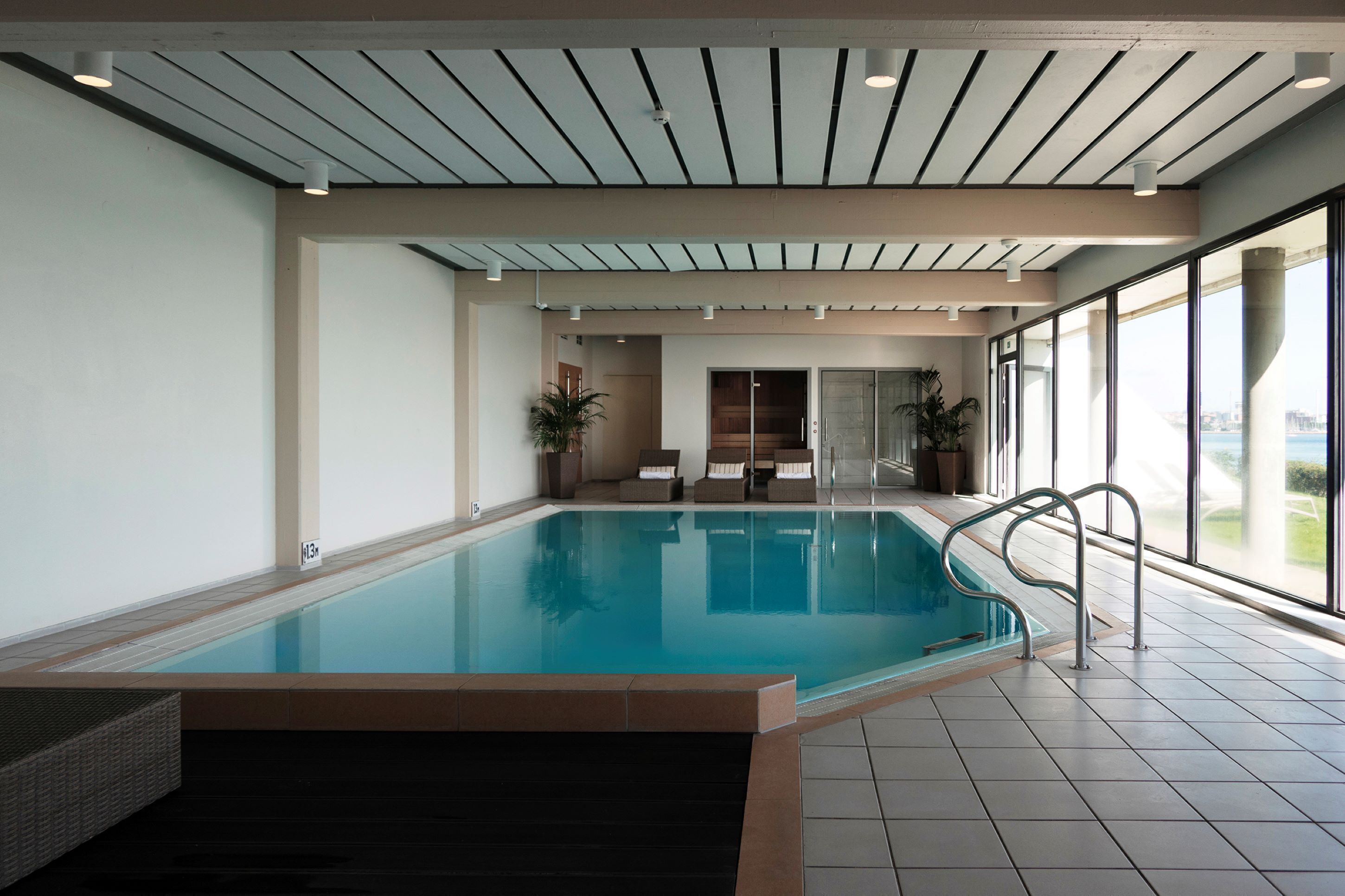 indoor pool, open 7:00 am to 11:00 pm, pool loungers