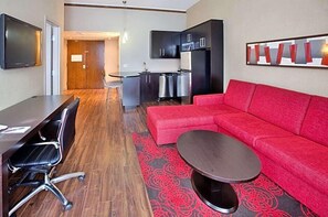 Deluxe Suite, 1 King Bed, Kitchen | Living area | 32-inch flat-screen TV with cable channels, TV, iPod dock