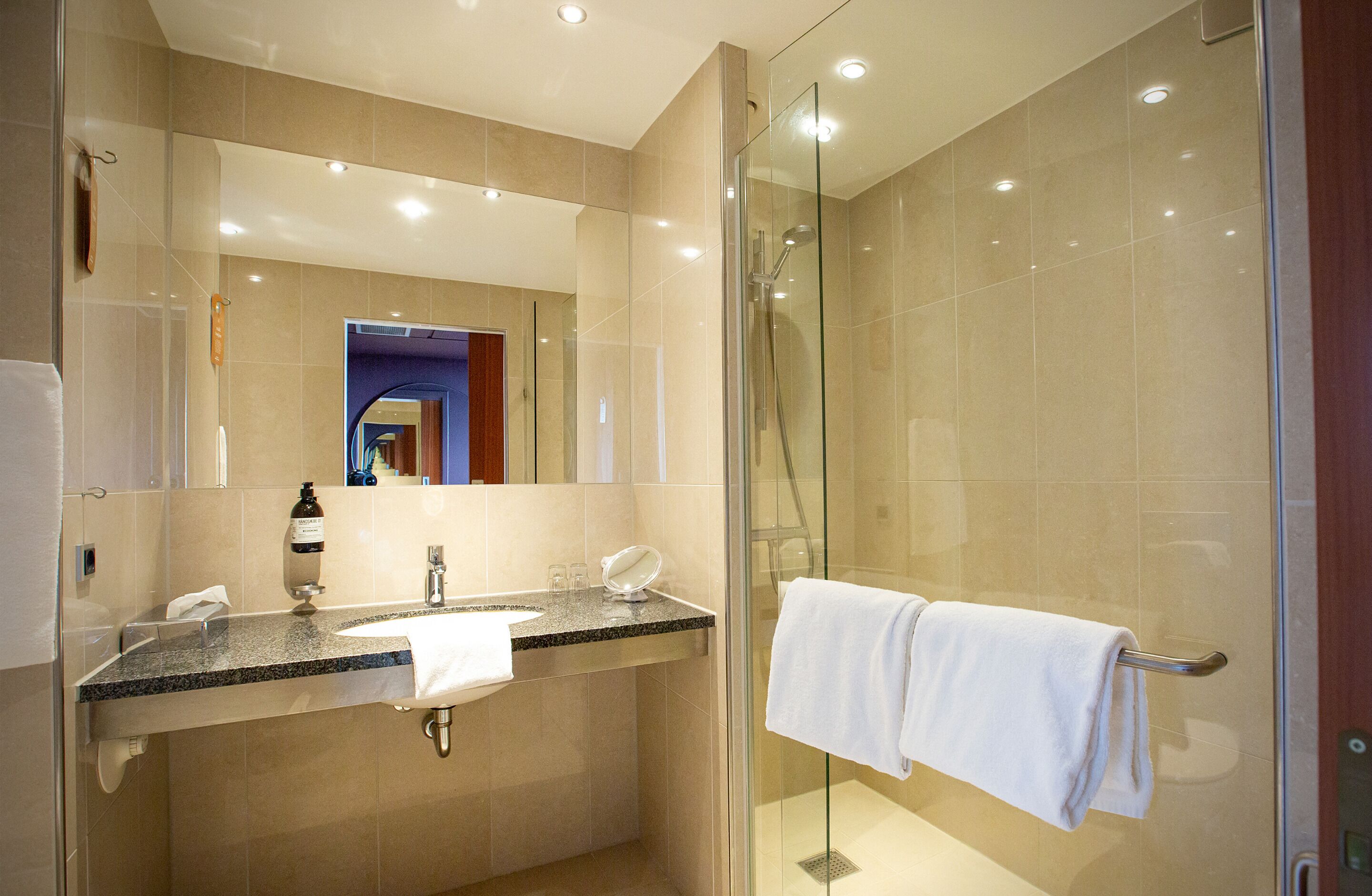 eco-friendly toiletries, hair dryer, towels, soap