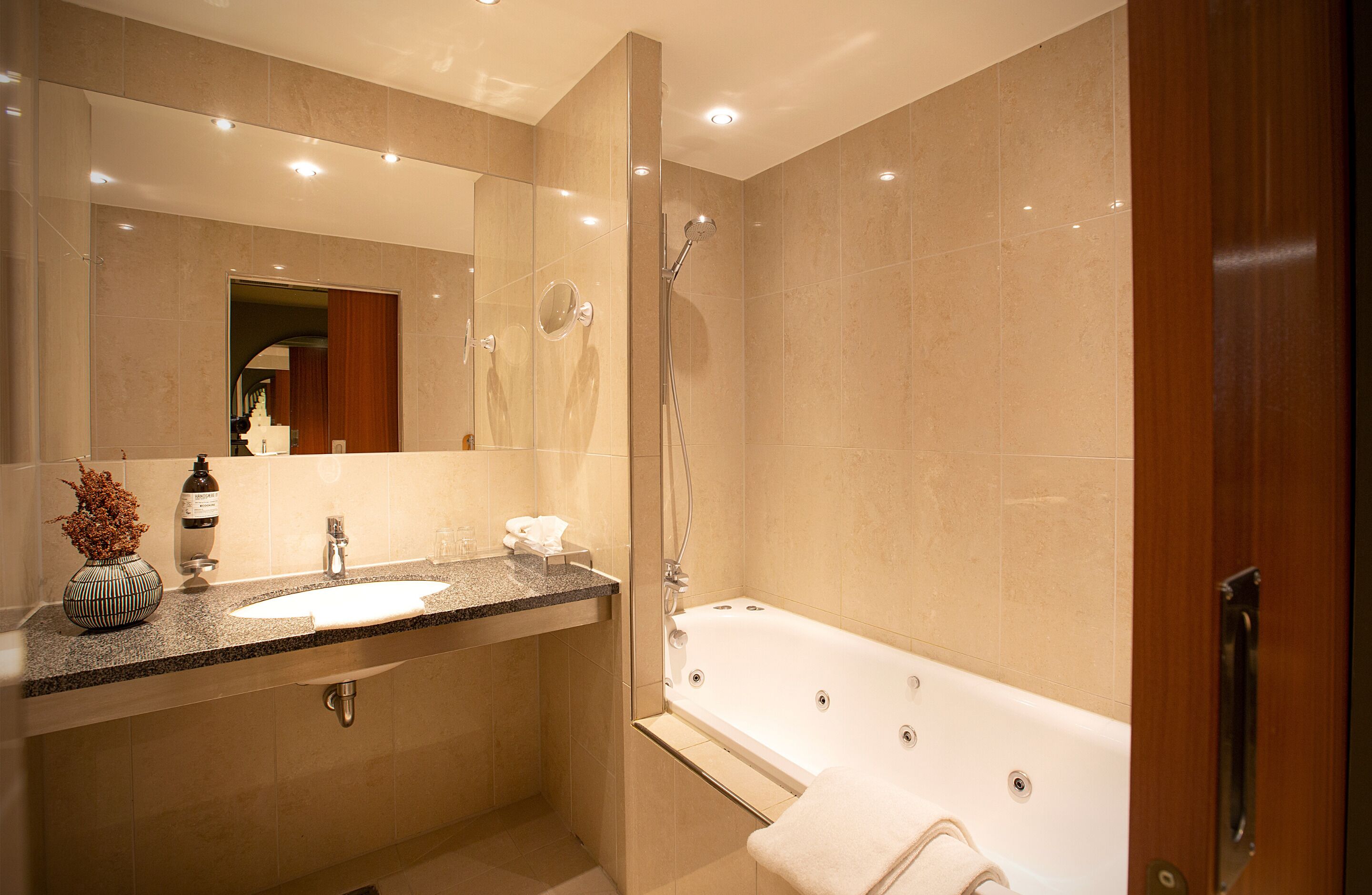 junior suite, 1 king bed | bathroom | eco-friendly toiletries, hair dryer, towels, soap
