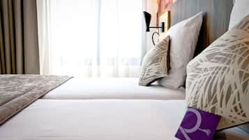 Premium bedding, memory-foam beds, minibar, in-room safe