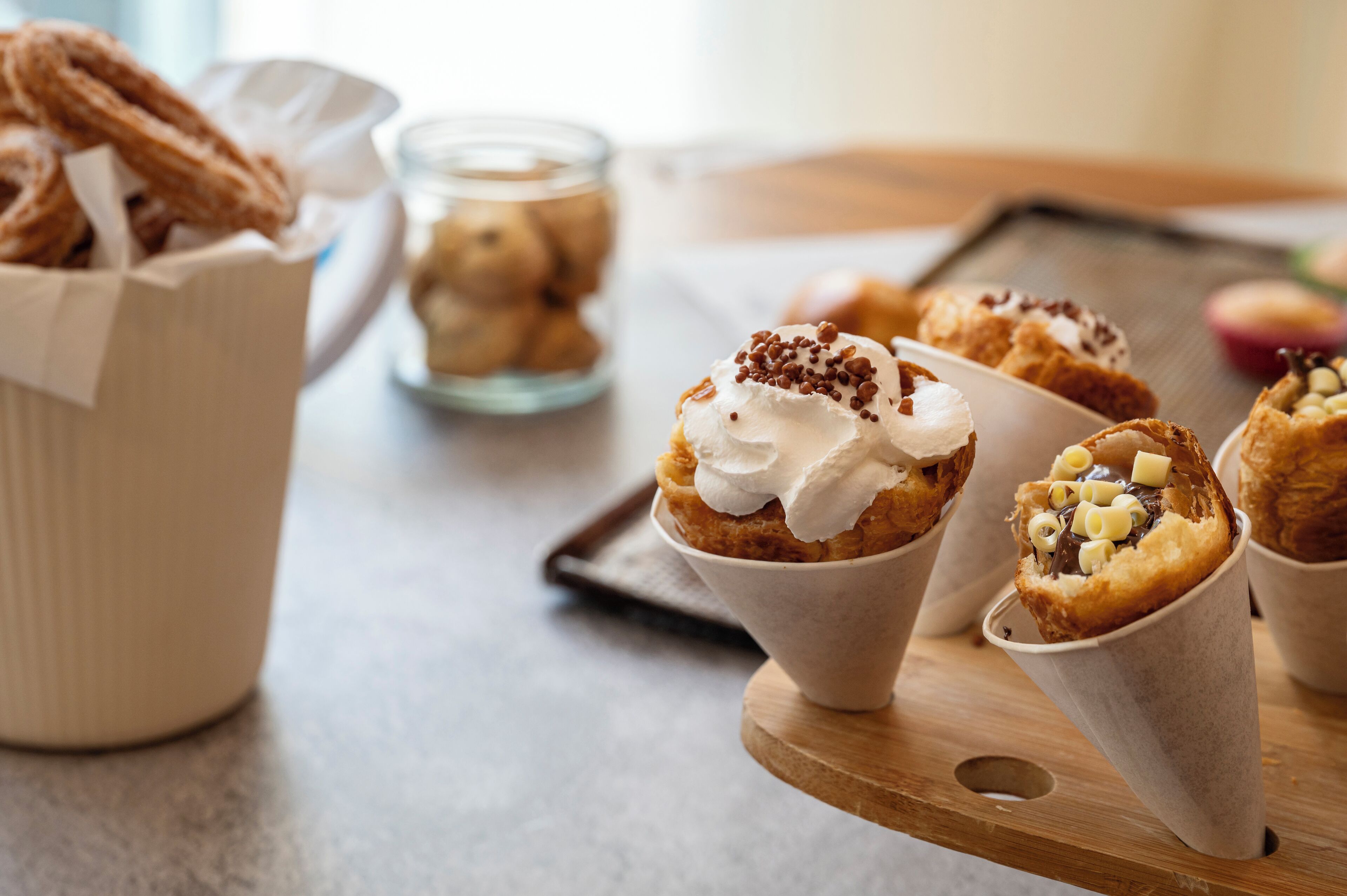 A tray with pastries and a cup of coffee.