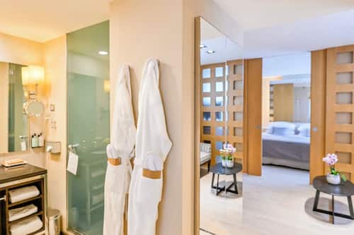 Eco-friendly toiletries, hair dryer, slippers, towels