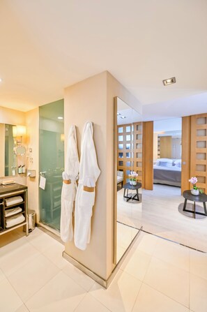Eco-friendly toiletries, hair dryer, slippers, towels