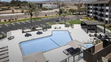 Outdoor pool, open 9:00 AM to 10:00 PM, pool umbrellas, sun loungers