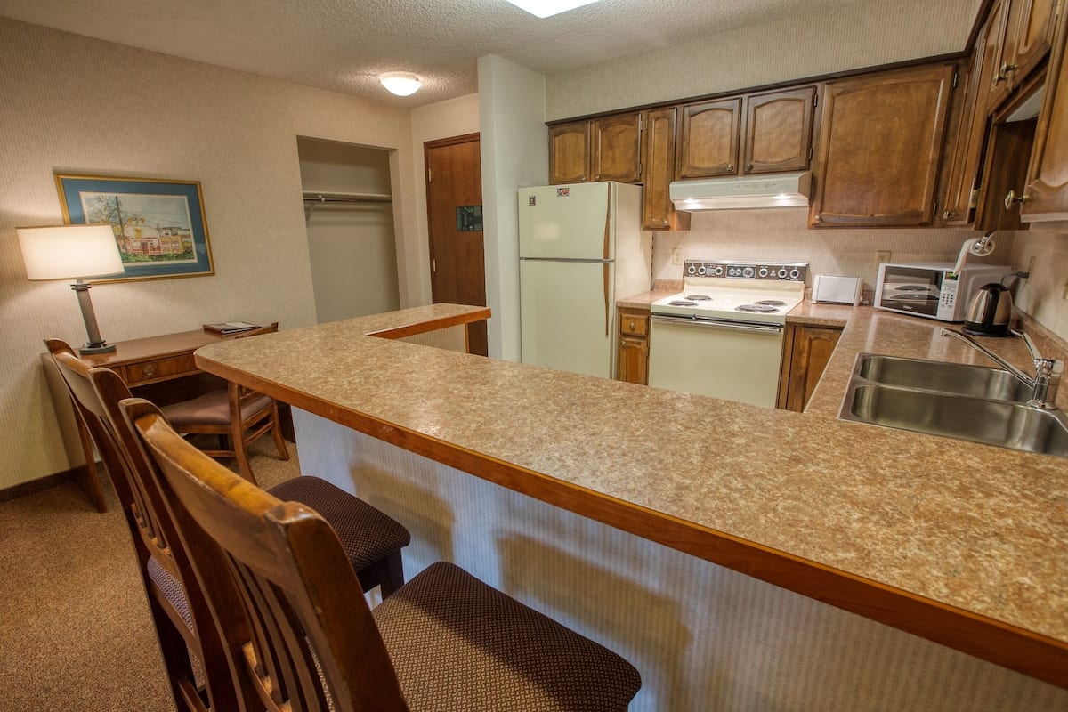 deluxe one bedroom king suite | private kitchen | full-sized fridge, microwave, coffee/tea maker