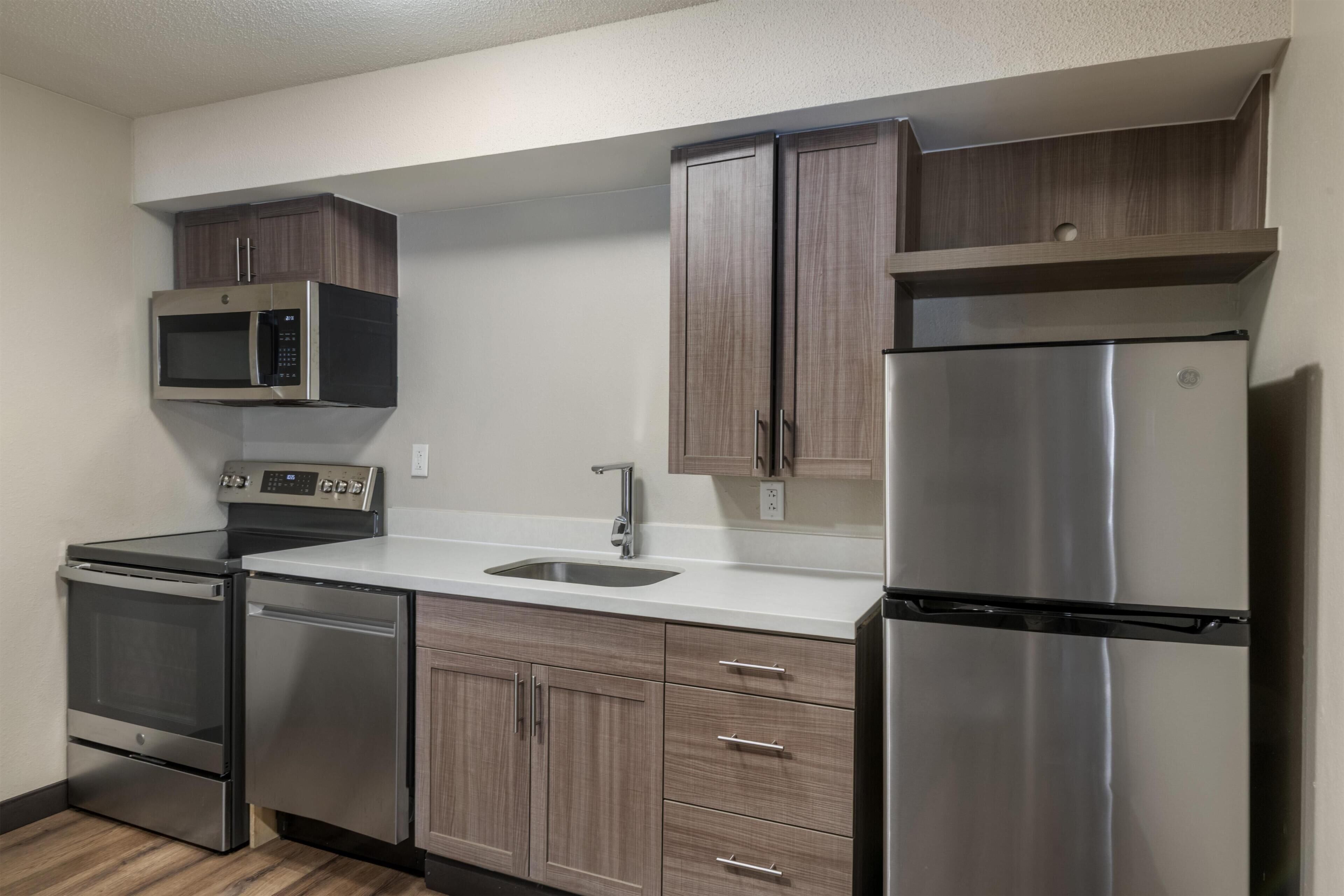 Suite, 1 King Bed, Non Smoking, Kitchen (with Sofabed) | Desk, laptop workspace, blackout drapes, iron/ironing board