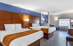 A hotel room with two beds, a desk, and a window. - Days Inn by Wyndham St. Louis Lindbergh Boulevard (St. Louis)