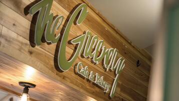 A wooden ceiling with a sign that reads 'The Cherrypal Cafe & Bakery'.