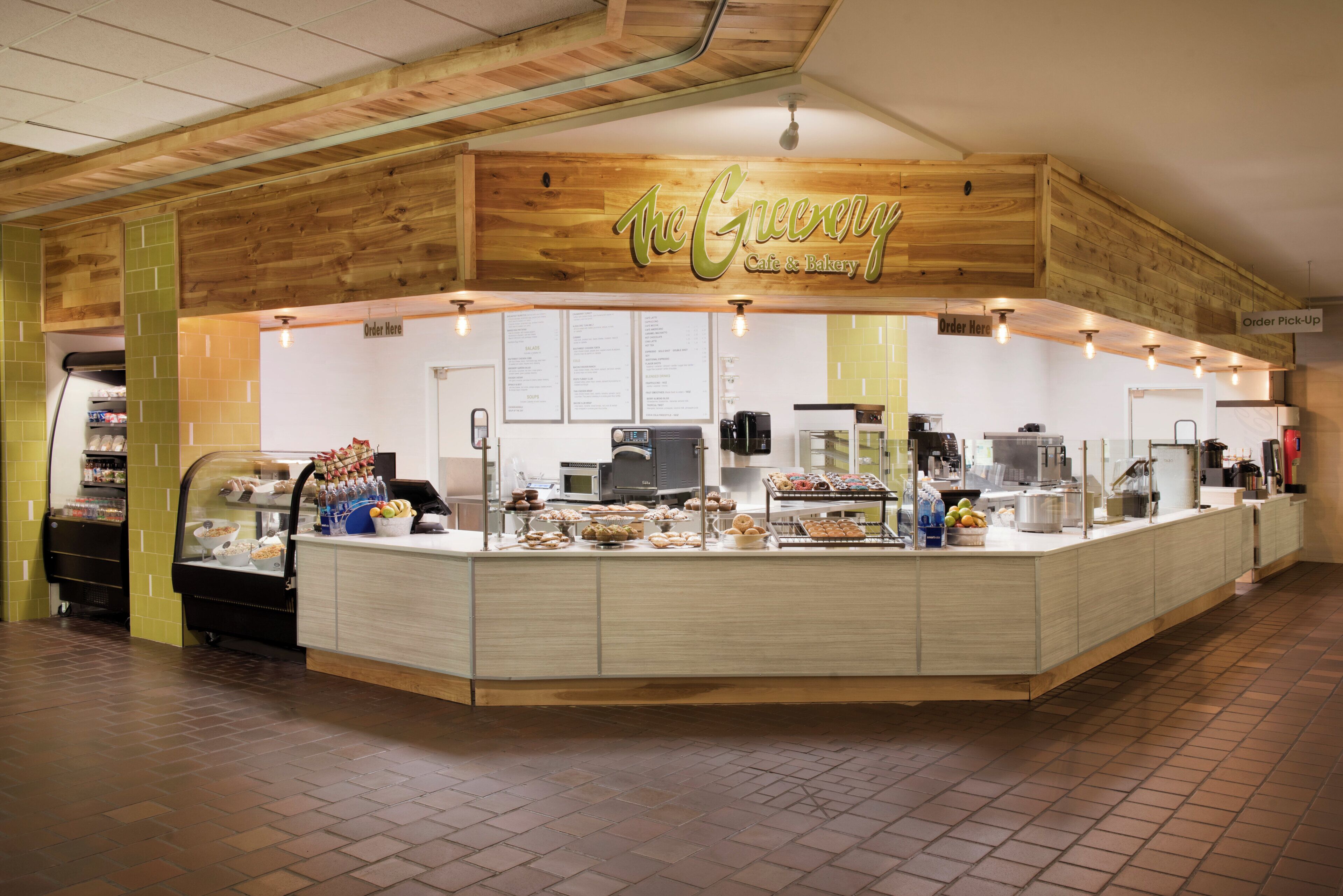 A cafe with a wooden facade and a menu board.