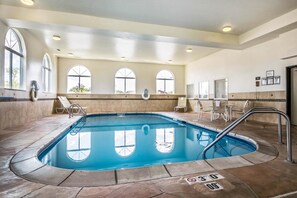 An indoor swimming pool with clear views through arched windows, a tiled floor, and a no diving sign. - Comfort Inn Ottawa Starved Rock Area (Ottawa)