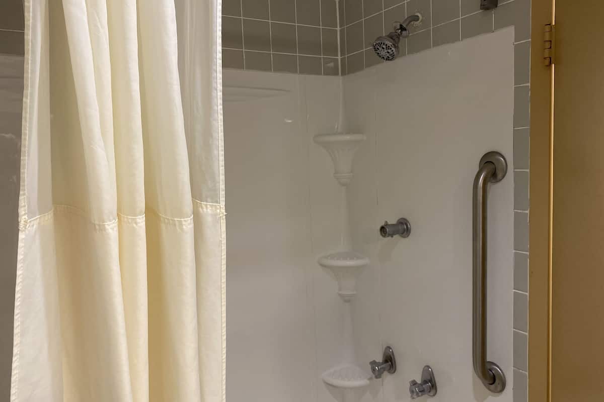 bathtub, free toiletries, hair dryer, towels