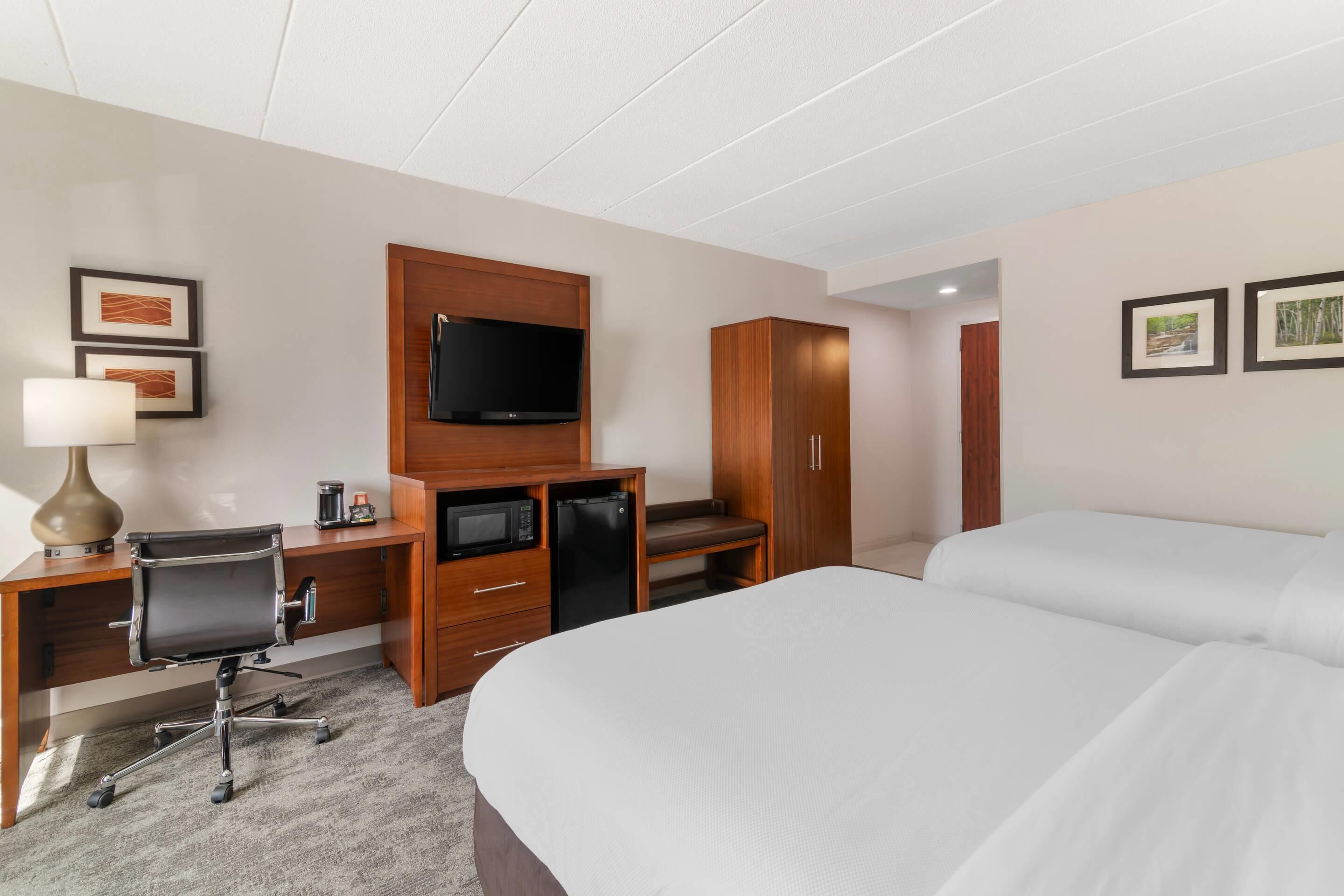 Premium bedding, memory foam beds, desk, laptop workspace