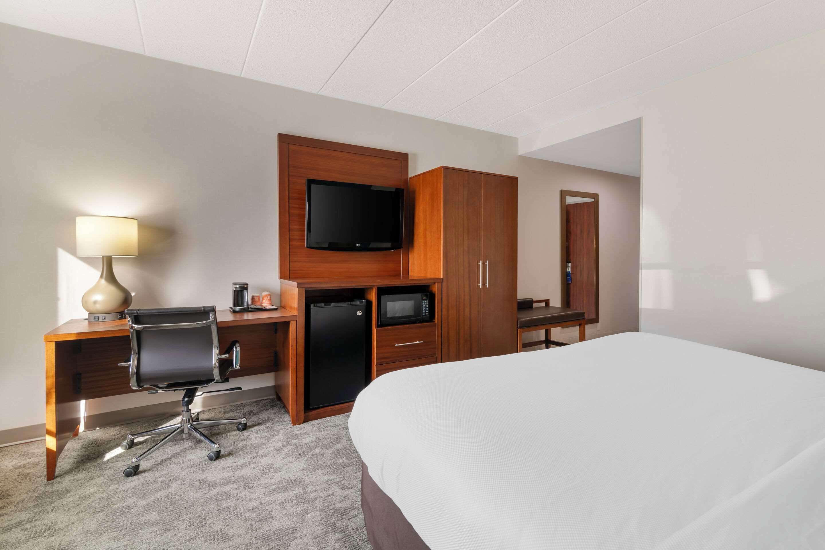 premium bedding, memory-foam beds, desk, laptop workspace