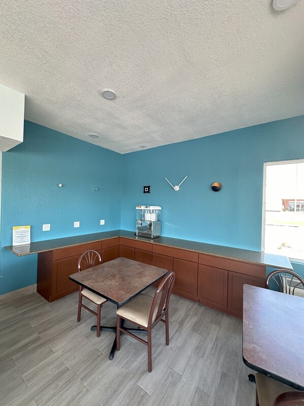 Enjoy a convenient kitchenette with a countertop, coffee machine, and dining area.