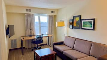 Standard Suite | Living area | 32-inch LCD TV with cable channels, TV
