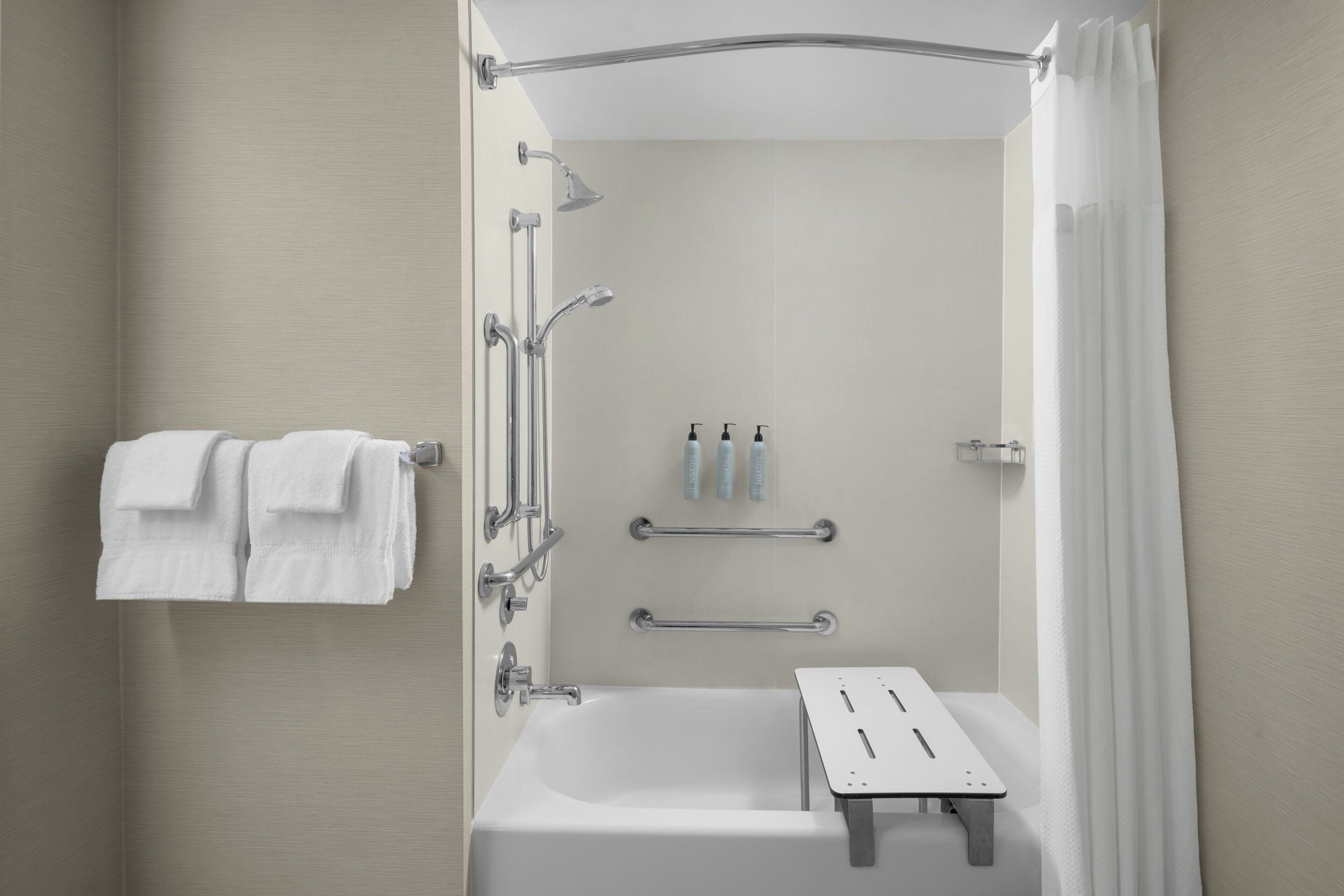 designer toiletries, hair dryer, towels