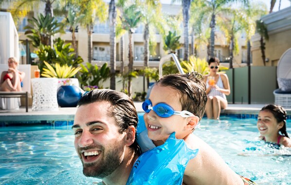 Outdoor pool, open 8:00 AM to 10:00 PM, pool cabanas (surcharge)