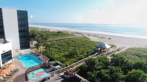 On the beach, sun-loungers, beach umbrellas, beach towels