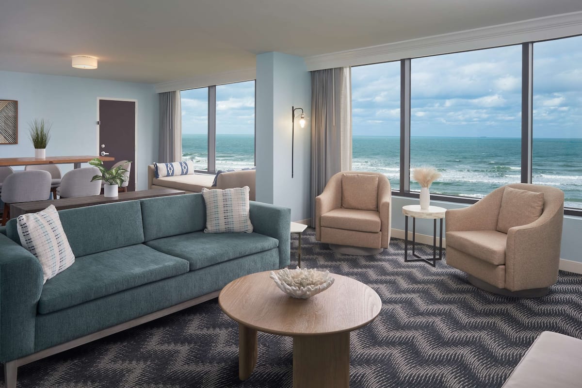Suite, 1 Bedroom, Oceanfront | Living area | 55-inch flat-screen TV with satellite channels, TV, Netflix