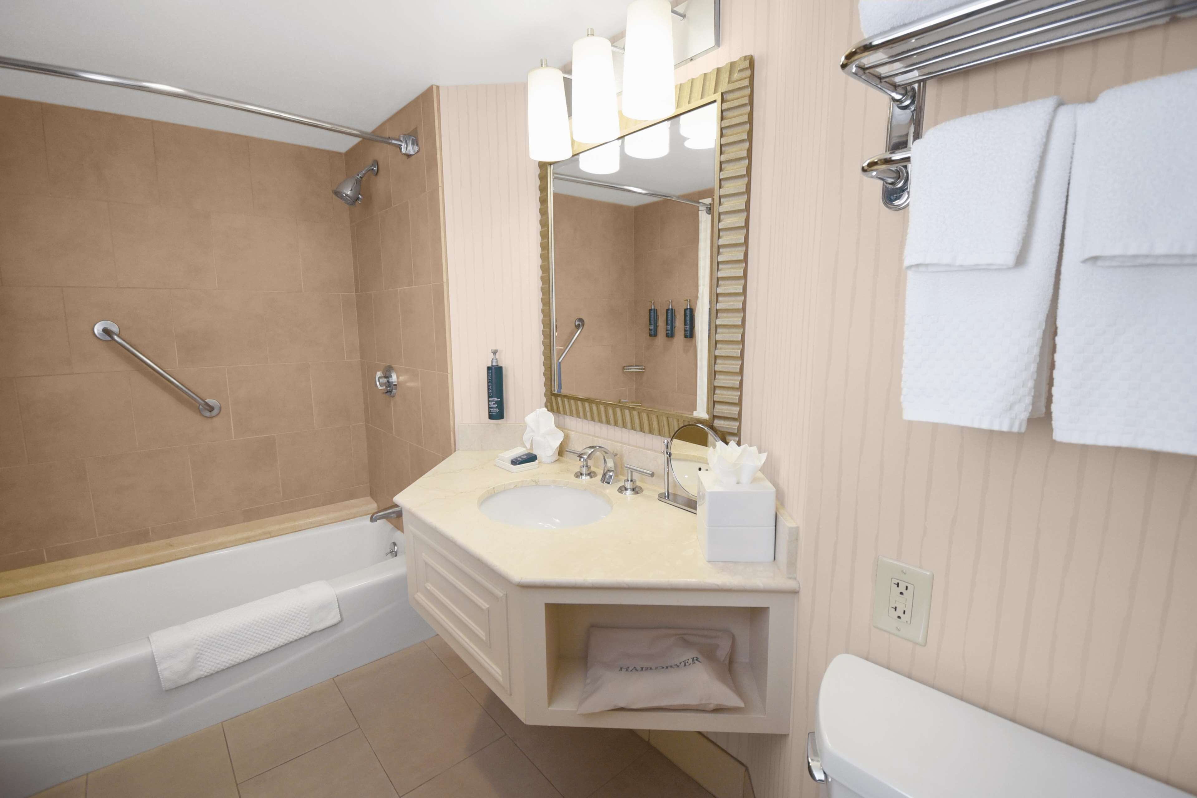 Combined shower/tub, designer toiletries, hair dryer, towels