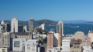 A cityscape with various buildings, including a prominent tower and several high-rise structures.