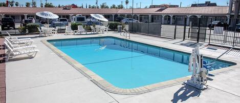 Outdoor pool, open 9:00 AM to 9:00 PM, free cabanas, pool umbrellas