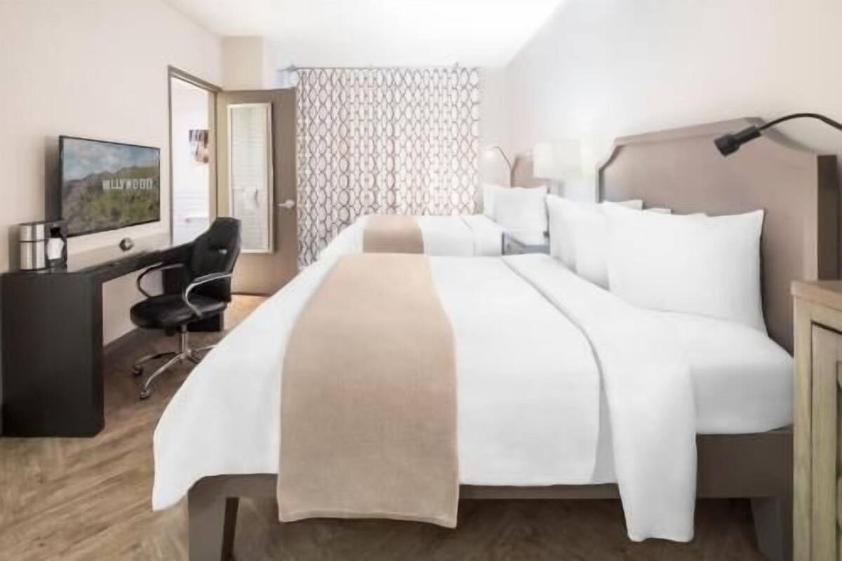 Hypo-allergenic bedding, down duvets, pillow-top beds, in-room safe