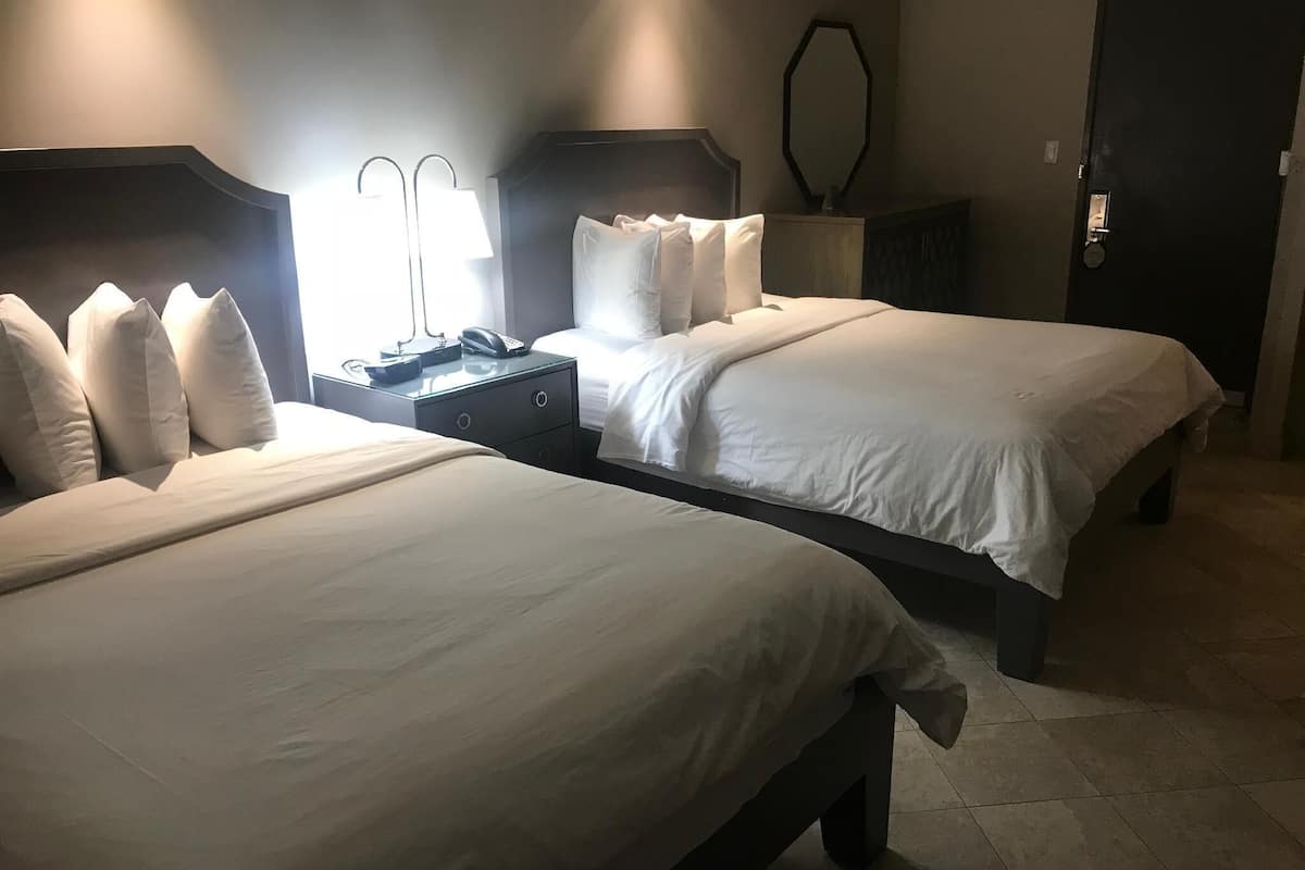 Hypo-allergenic bedding, down duvets, pillow-top beds, in-room safe