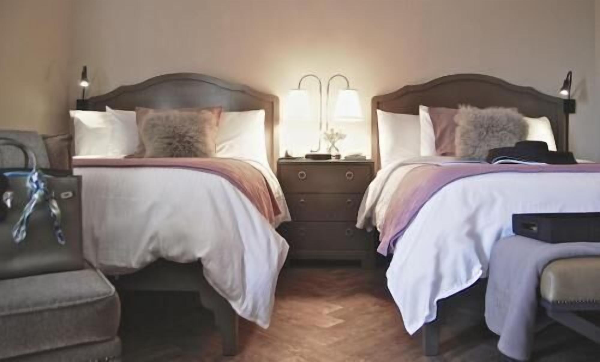 Hypo-allergenic bedding, down duvets, pillow-top beds, in-room safe