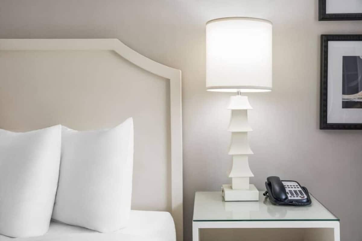 Hypo-allergenic bedding, down duvets, pillow-top beds, in-room safe