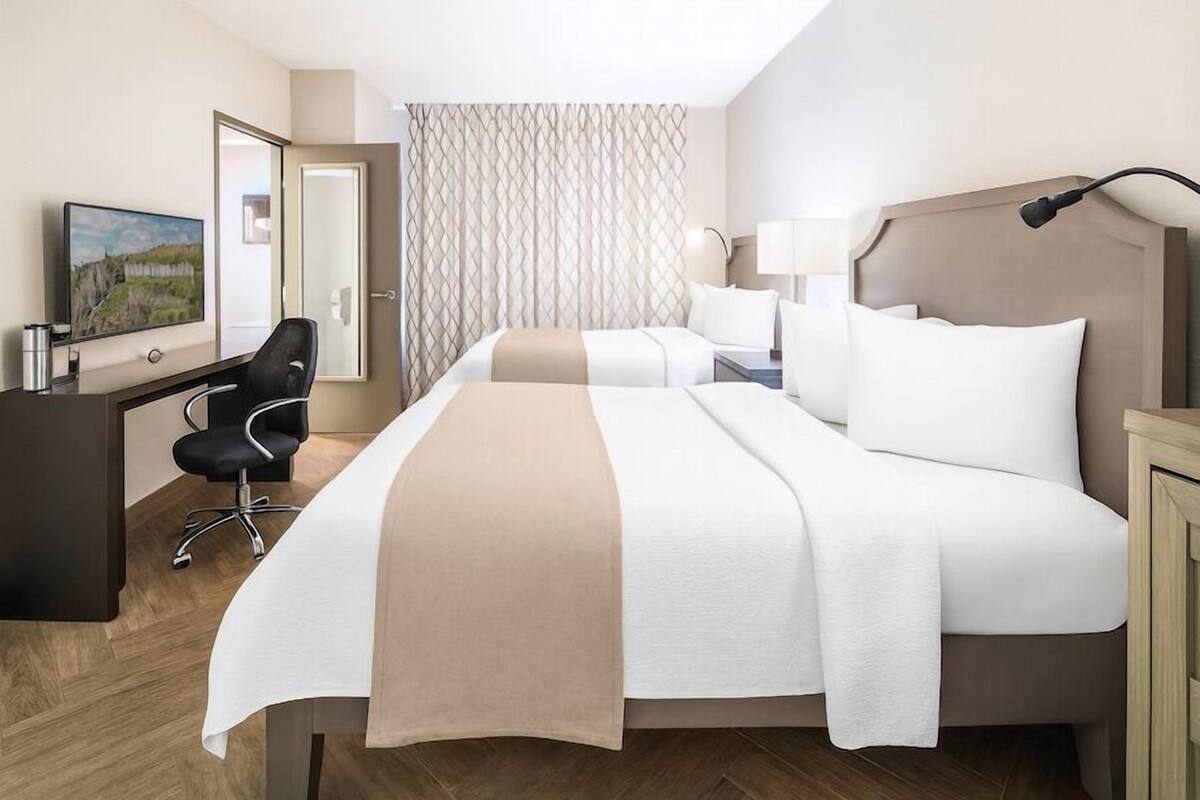 Hypo-allergenic bedding, down duvets, pillow-top beds, in-room safe