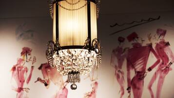 A chandelier with a chain of crystals hanging from it.