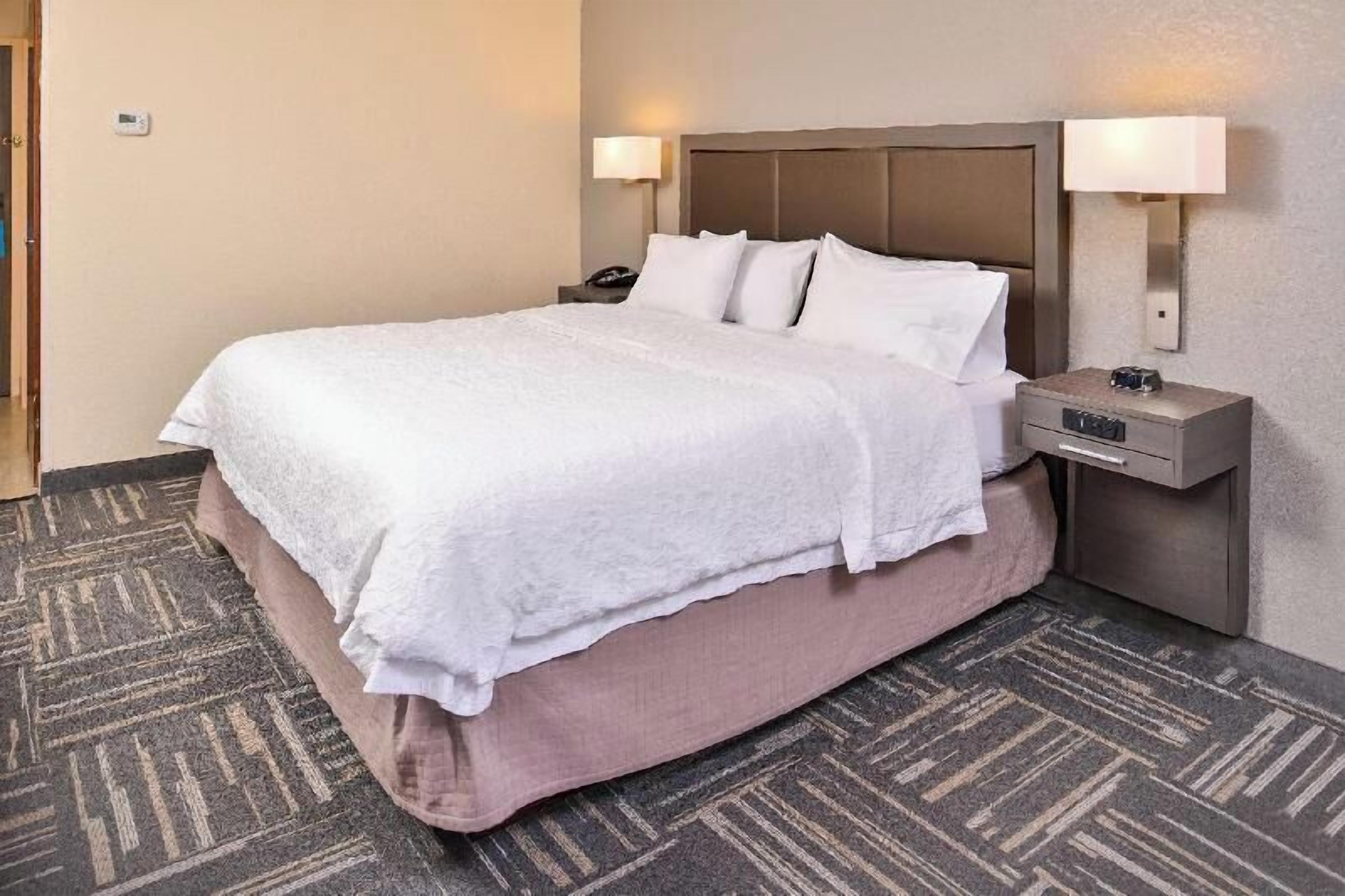 Premium bedding, down comforters, pillowtop beds, in-room safe