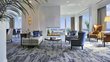 Luxury Suite, 2 Bedrooms | Living area | 37-inch TV with cable channels, pay movies