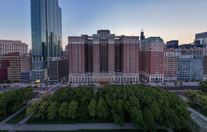 A large, historic building with a central courtyard surrounded by trees. - Hilton Chicago (Chicago)