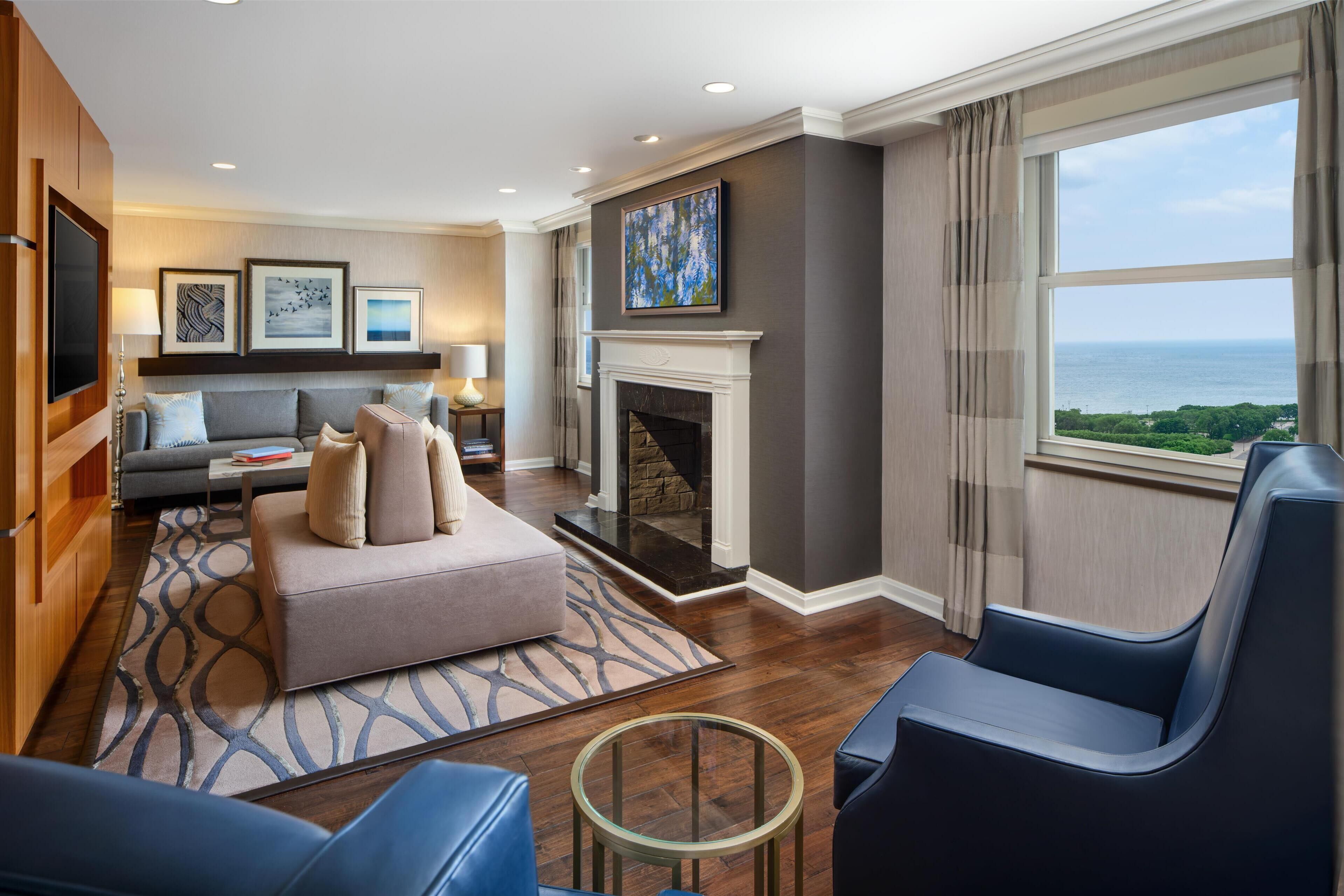 suite, multiple beds, lake view | living area | 37-inch tv with cable channels, pay films