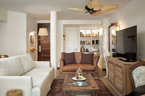 Senior Suite | Living area | 43-inch flat-screen TV with satellite channels, TV