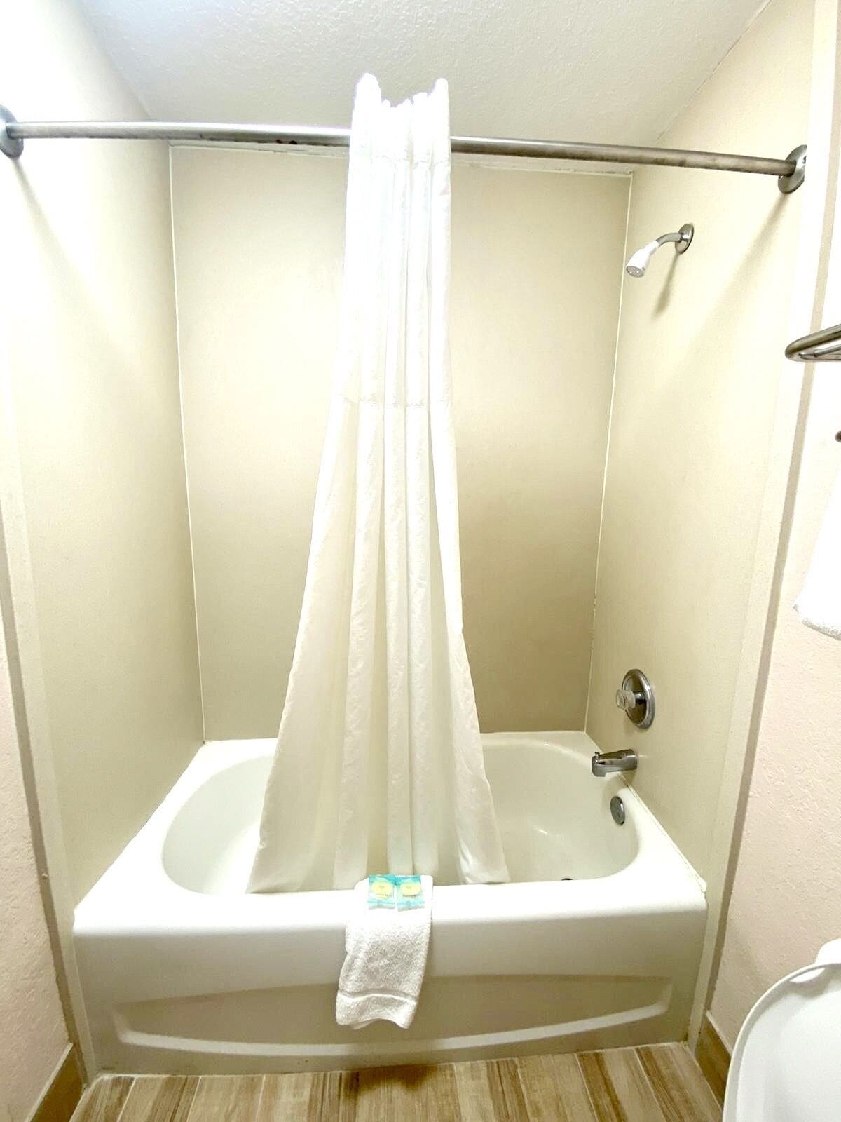 Bathtub, free toiletries, hair dryer, towels