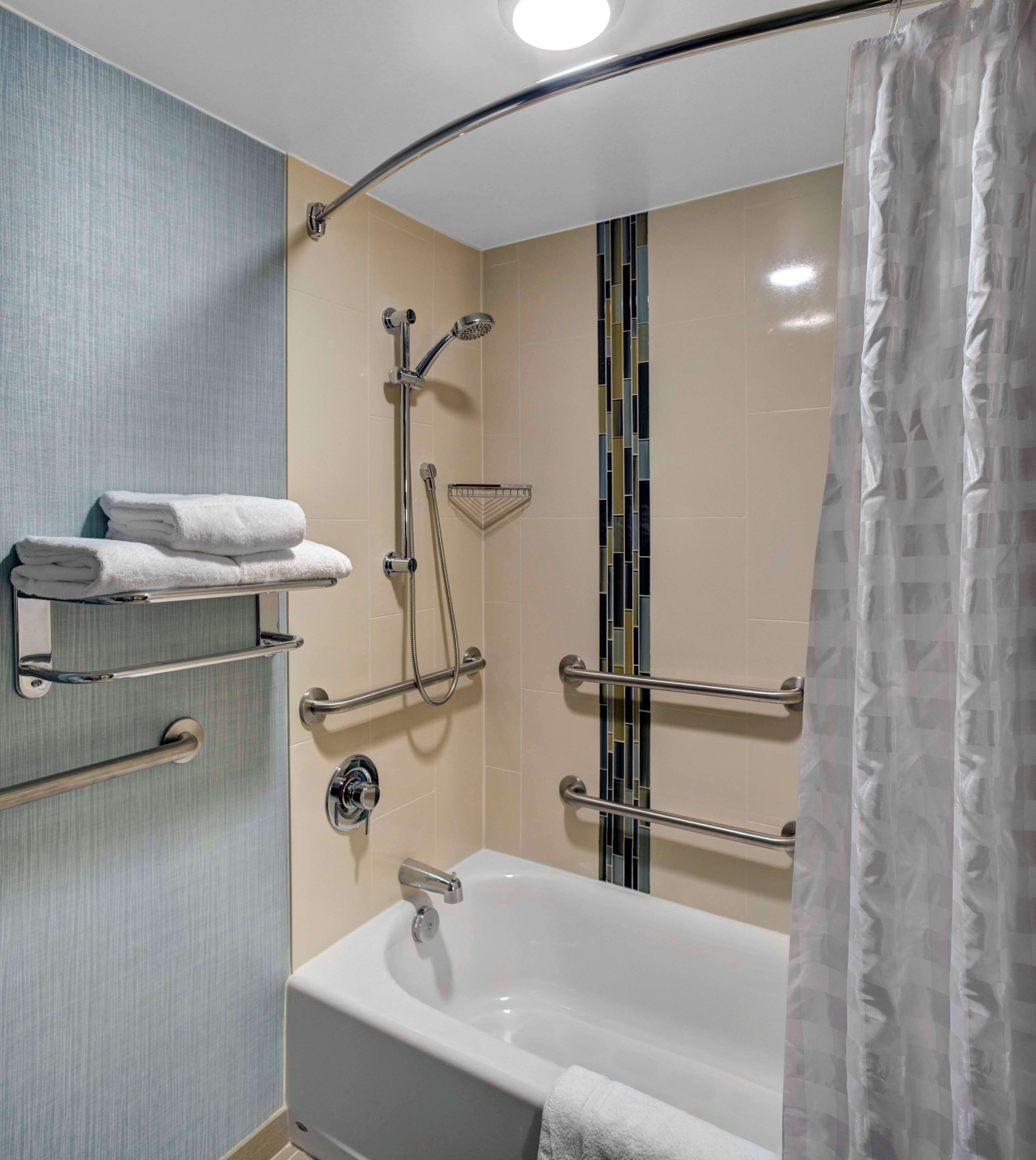 room, 1 king bed, accessible, bathtub | bathroom | combined shower/bathtub, designer toiletries, hair dryer, towels