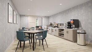 A modern kitchen with a dining area, featuring a counter with appliances and a trash bin. - Hyatt Select Nashville/Opryland (Nashville)