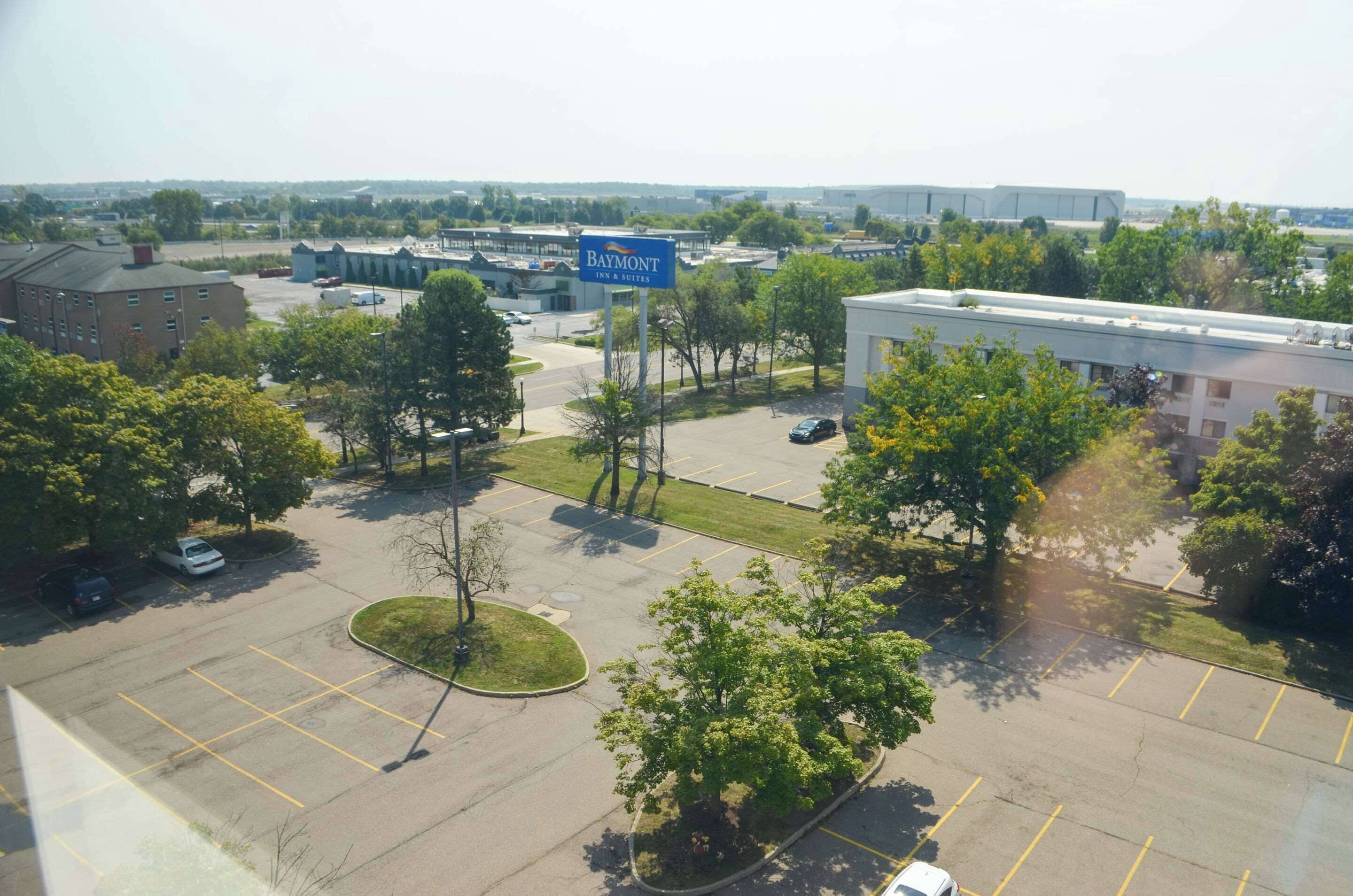A parking lot with a sign for Baymont Inn & Suites.