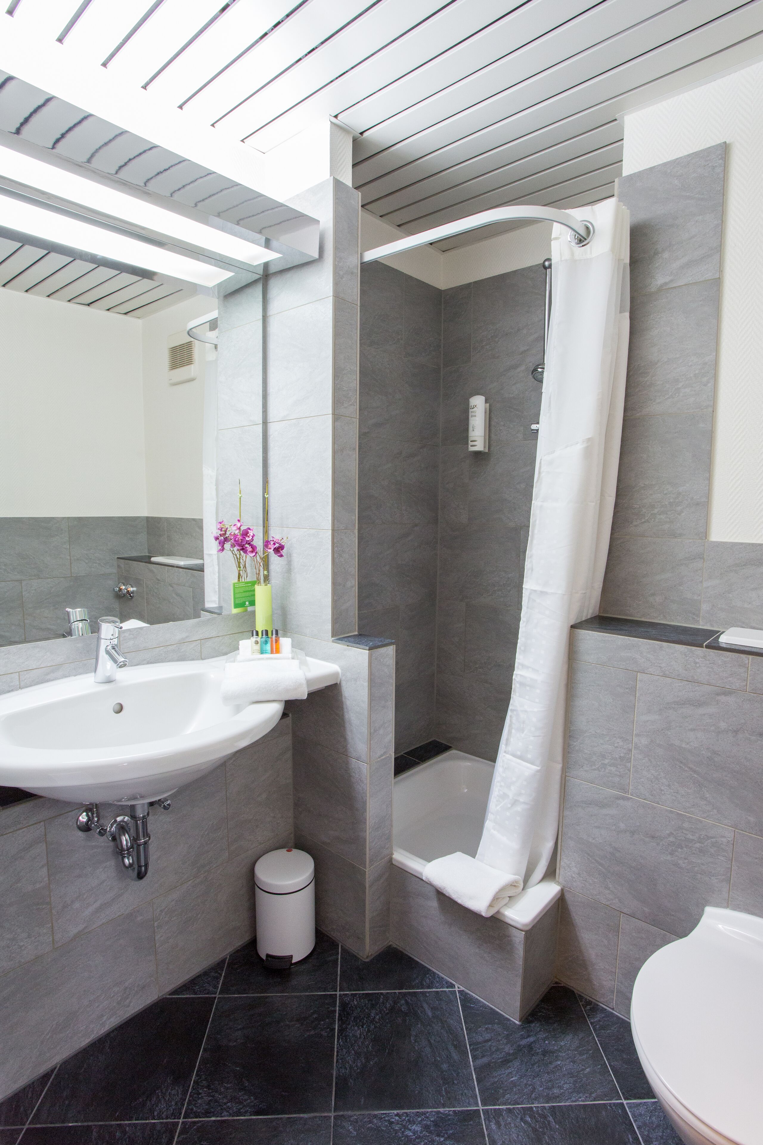 hair dryer, slippers, towels