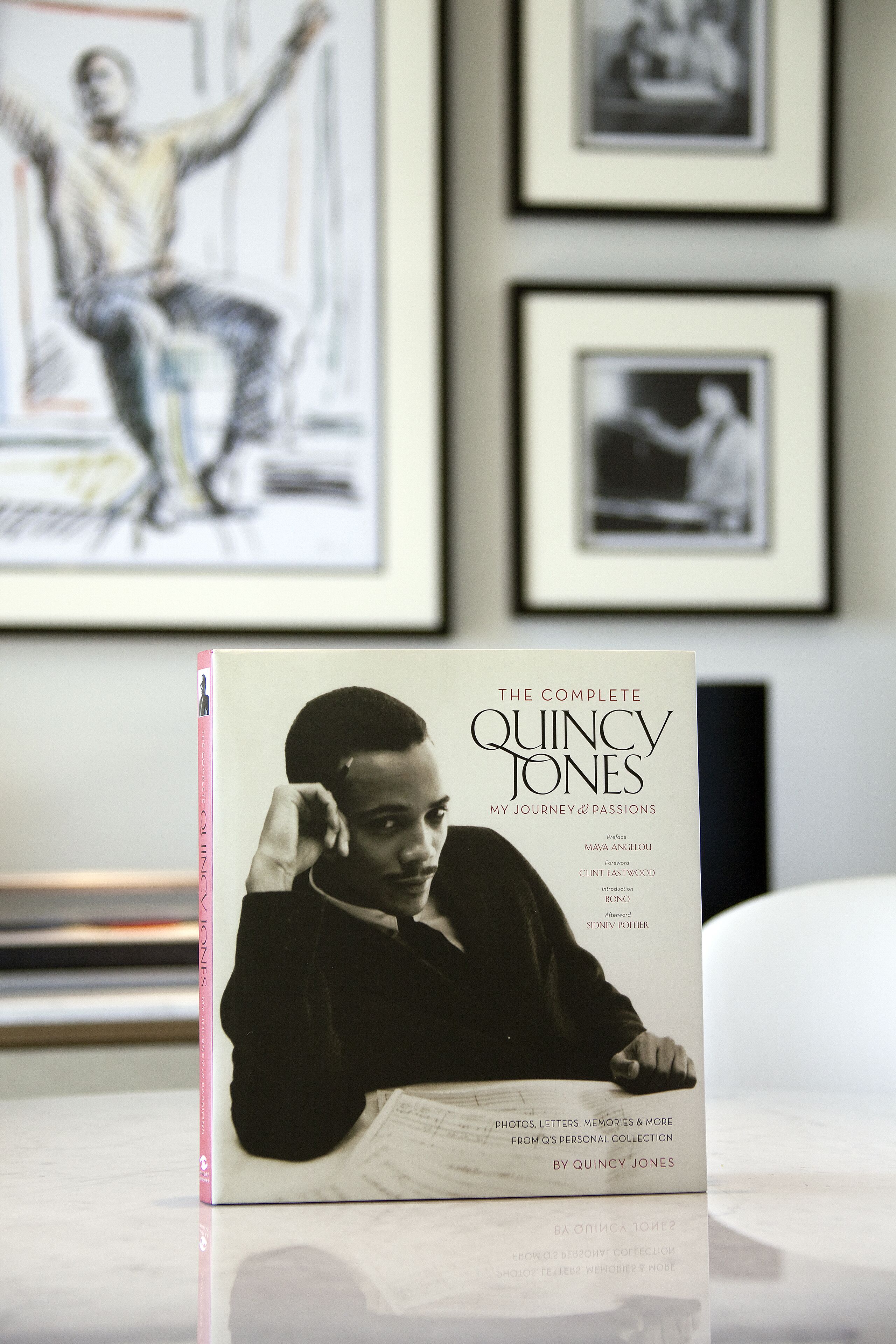 A book titled 'The Complete Quincy Jones' on a table.