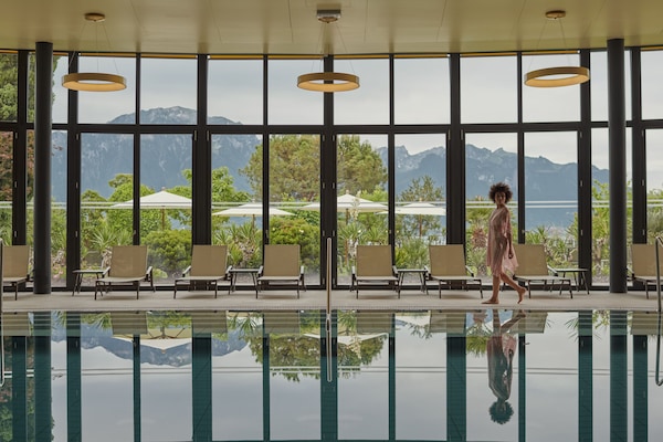 Indoor pool, outdoor pool, pool umbrellas, pool loungers