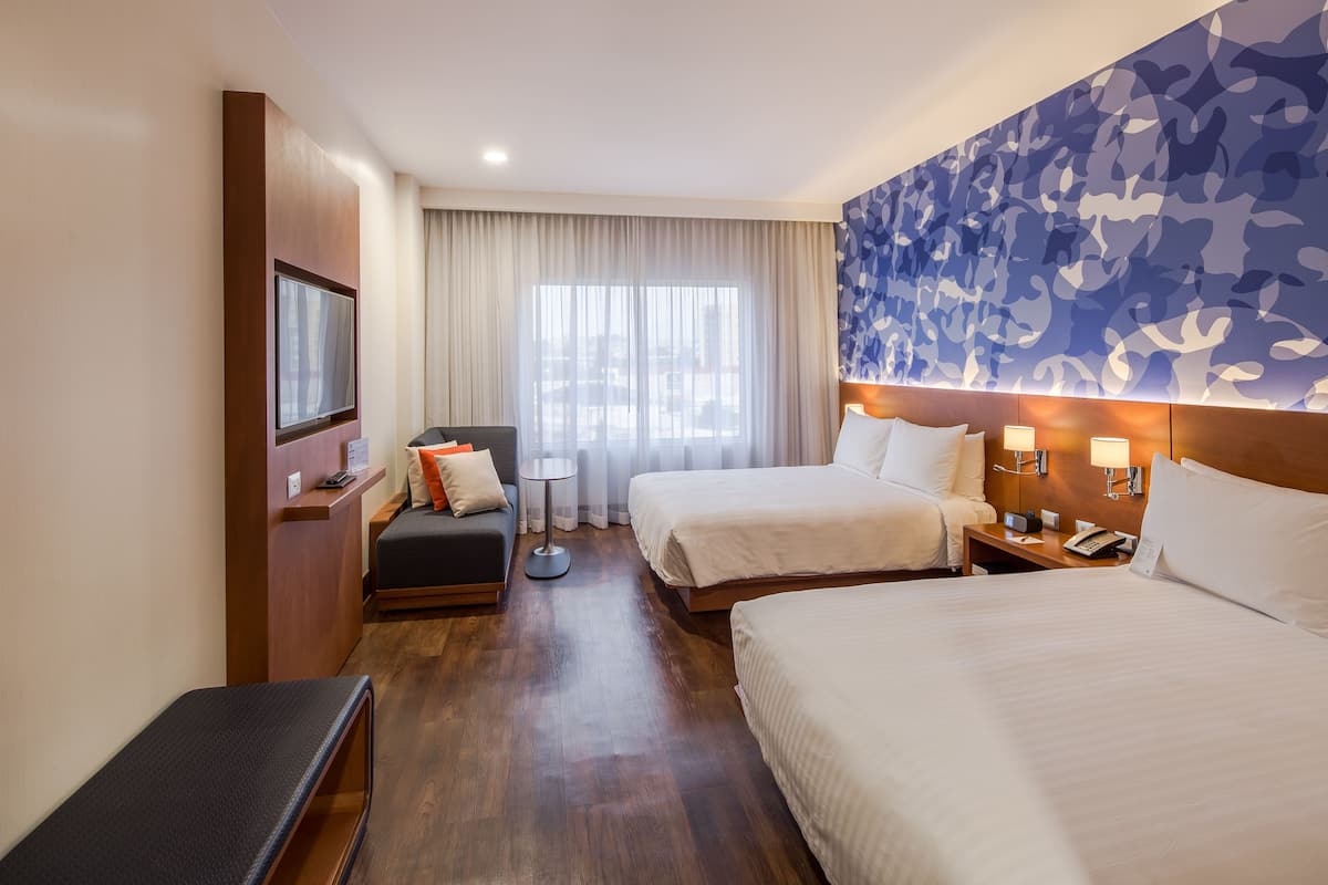 room, 2 queen beds | 1 bedroom, down duvets, in-room safe, desk