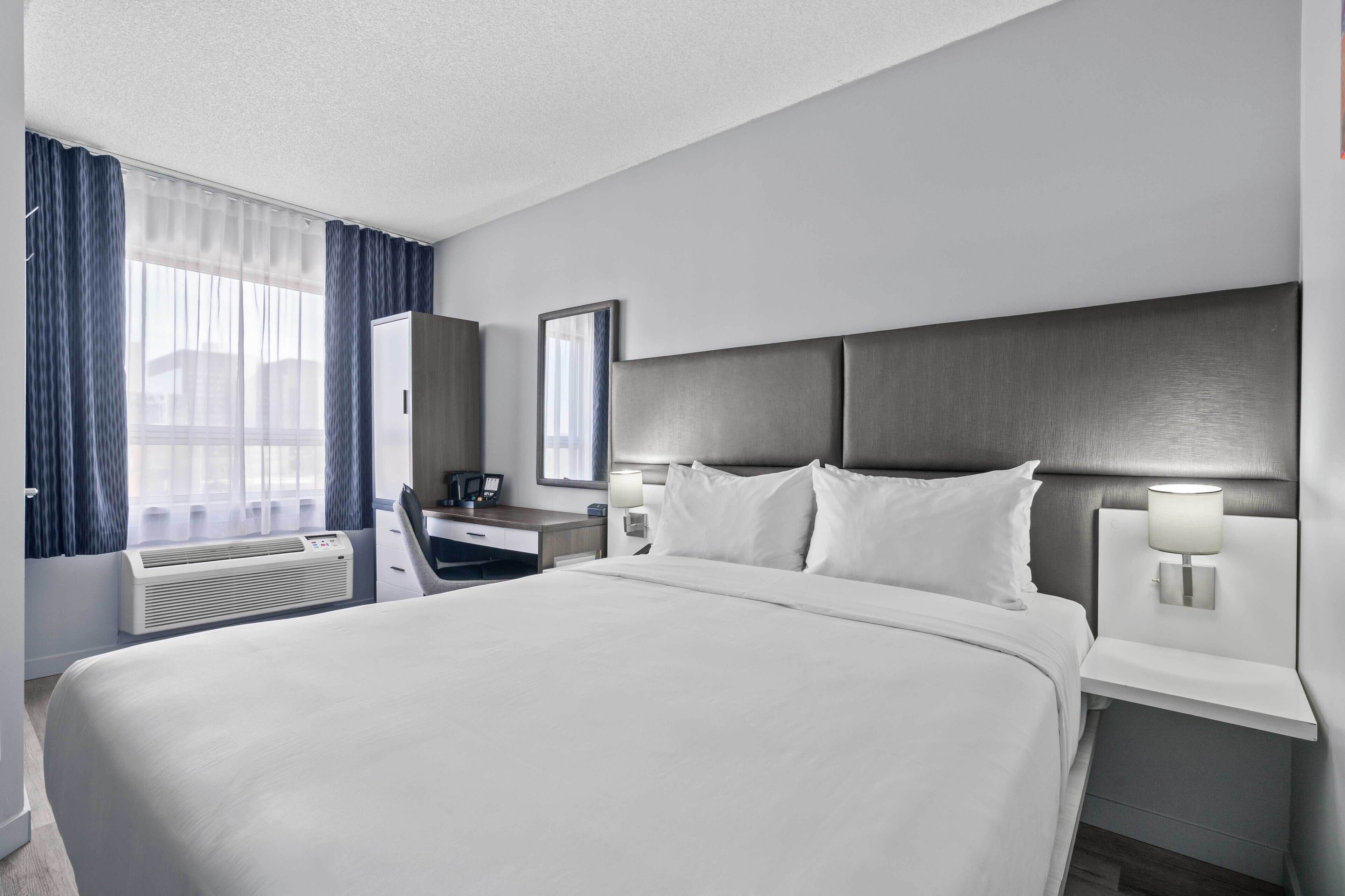 Room, 1 Queen Bed, Non Smoking | In-room safe, iron/ironing board, free cribs/infant beds, bed sheets