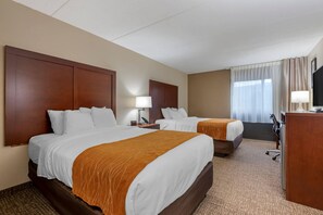 A hotel room with two beds, a desk, a TV, and a window with curtains. - Comfort Inn Binghamton I-81 (Binghamton)
