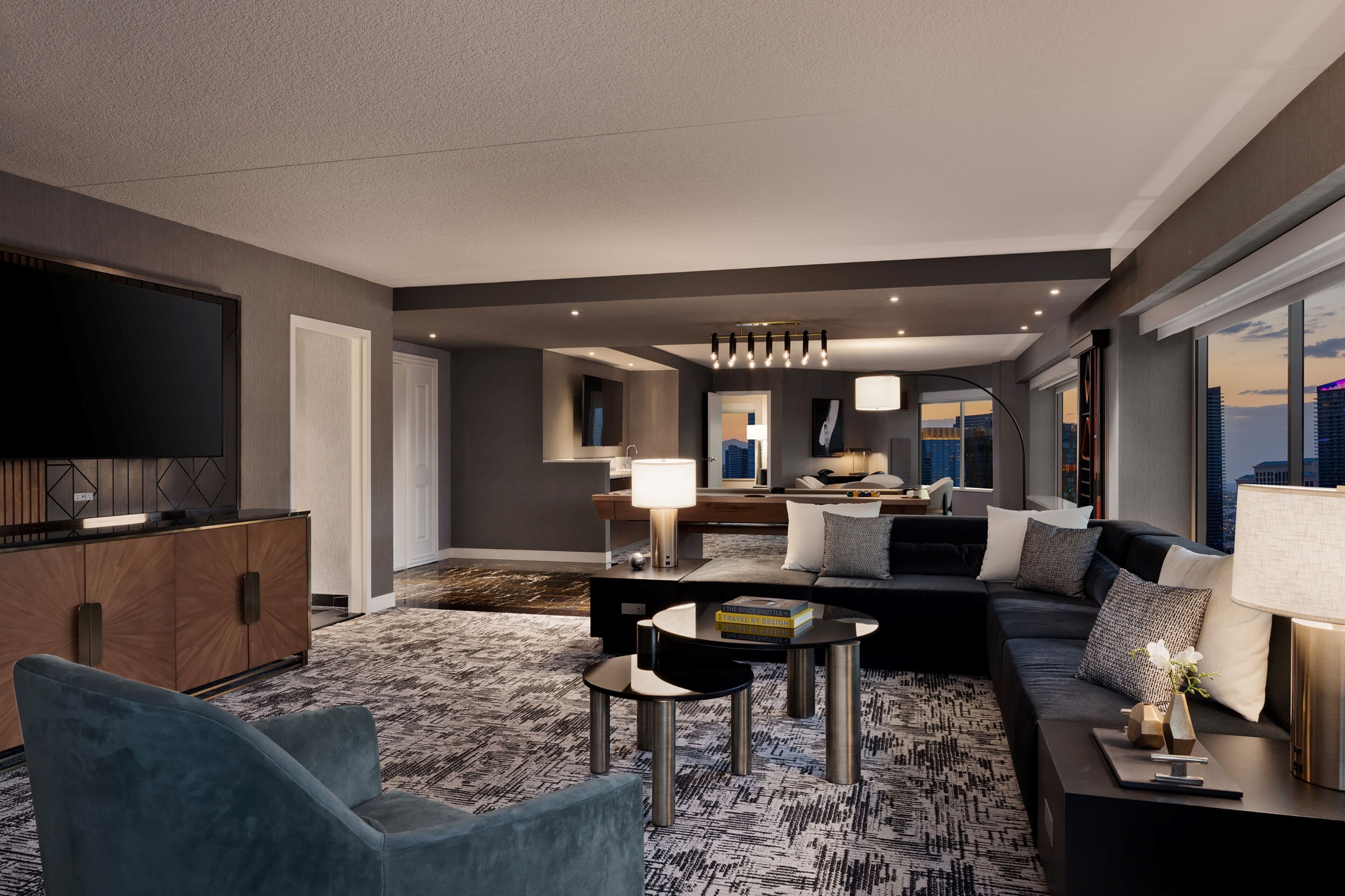 A modern living room with a sofa, coffee table, and TV.